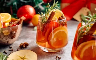 christmas mulled wine with cinnamon stick and citrus slices