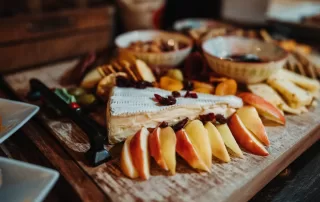 apples and cheese on a charcuterie board