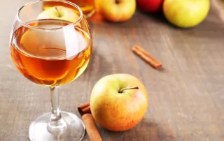 apples and apple wine in a wine glass
